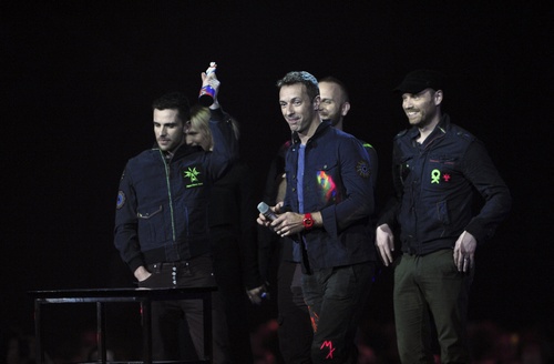 Chris Martin, Jonny Buckland, Guy Berrym